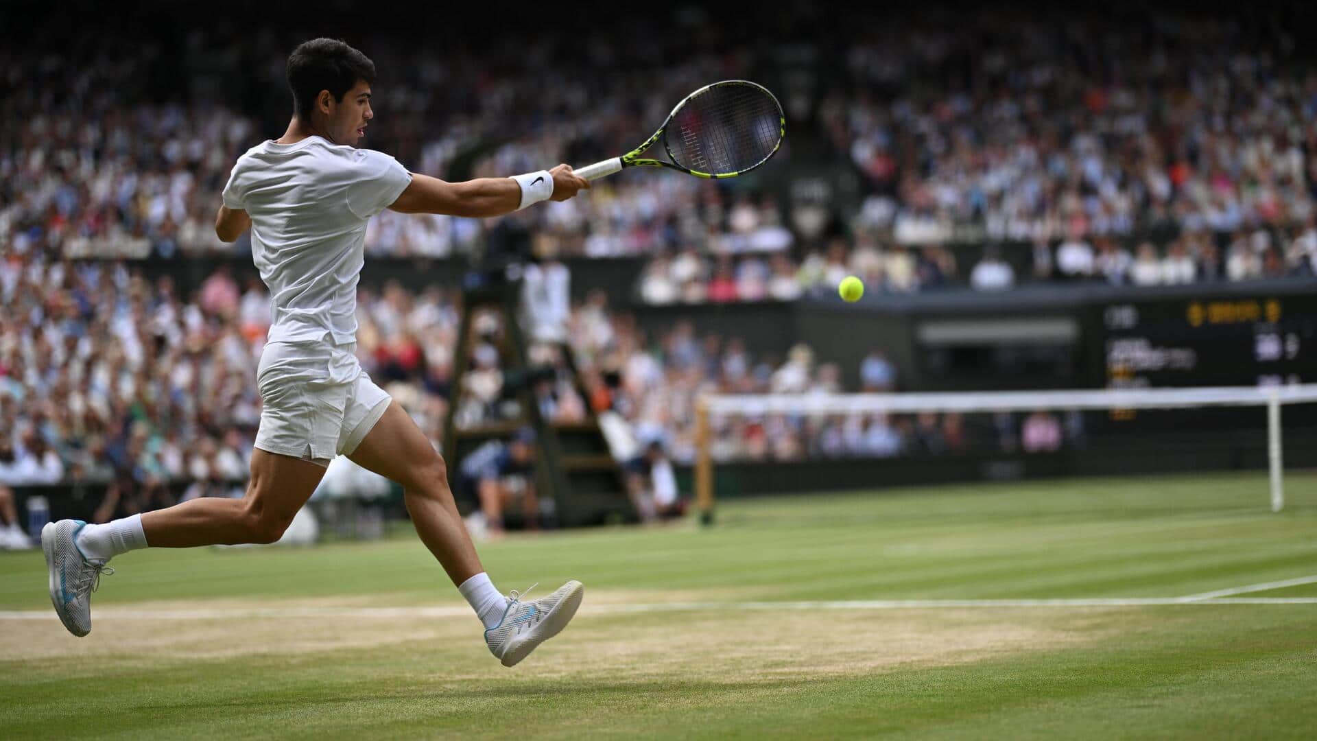 Carlos Alcaraz in action at Wimbledon 2024